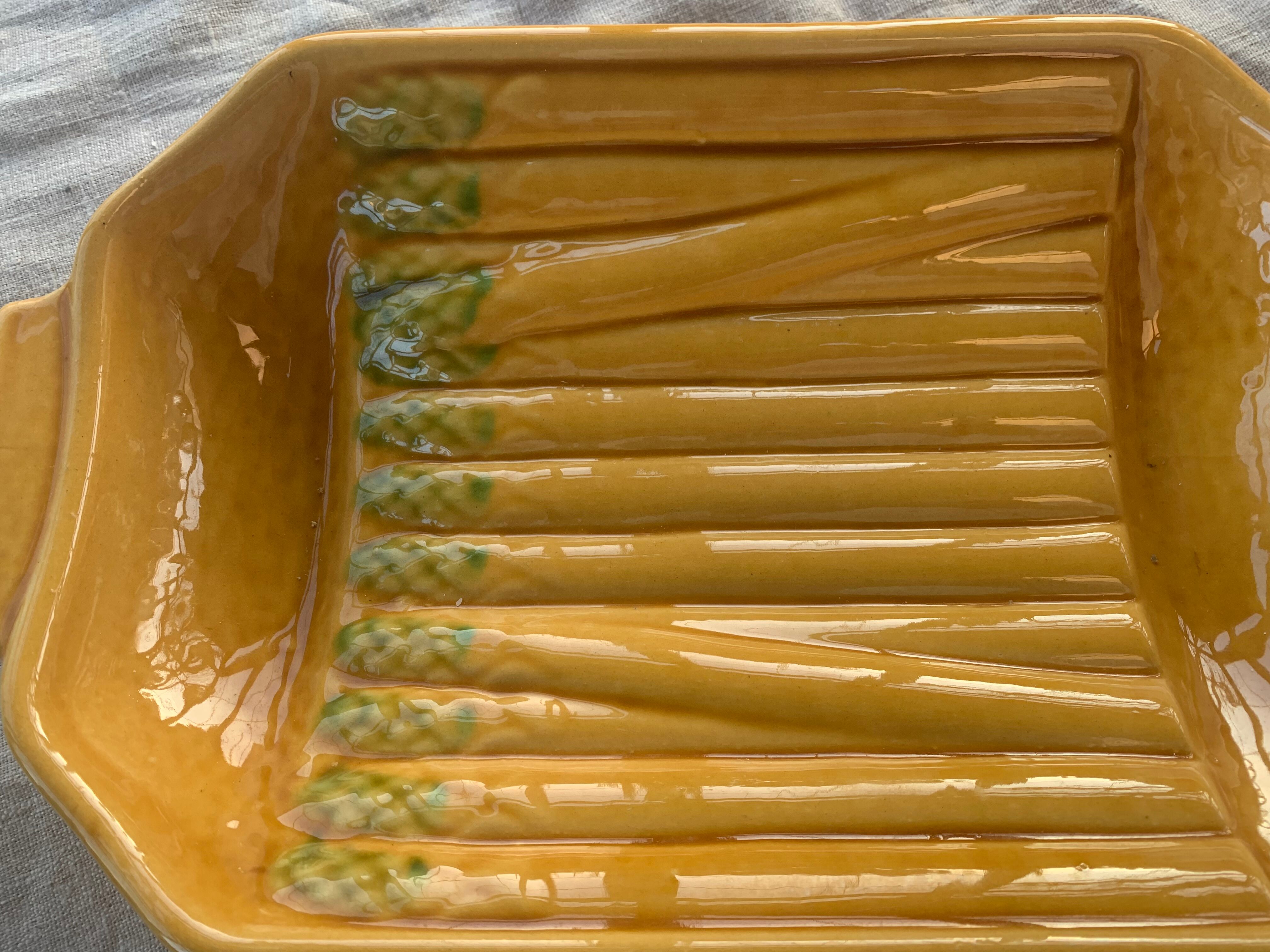 Vintage slip glazed ceramic asparagus dish