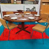 Baumann style round table with integrated extensions from the 70s