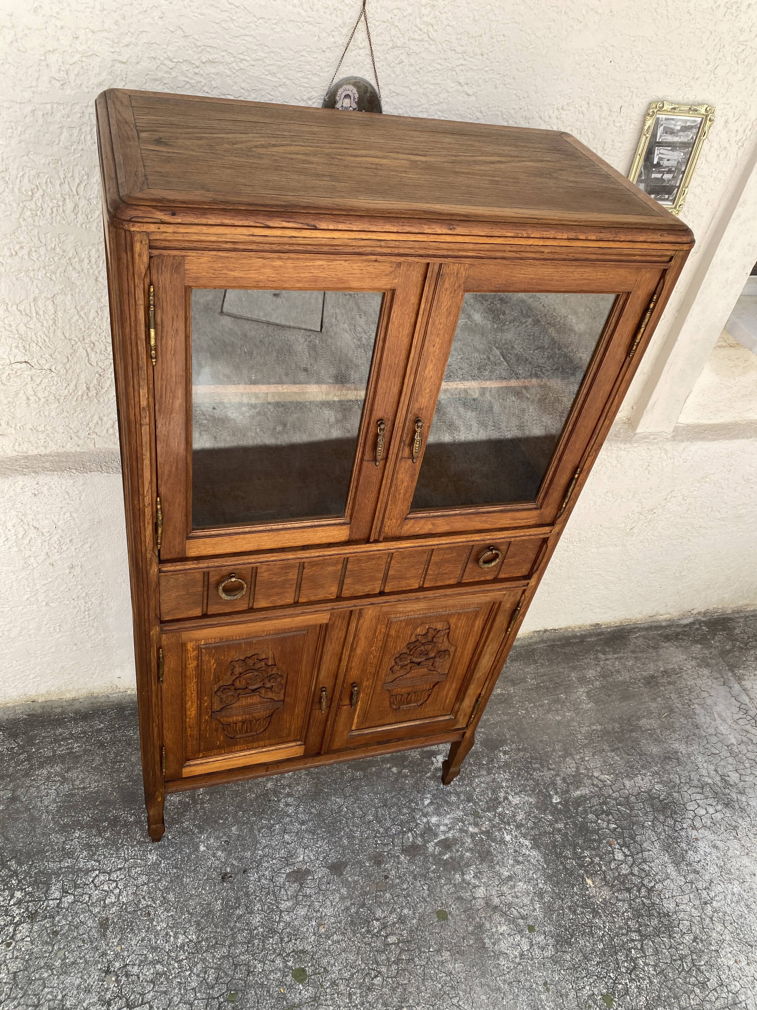 Old small glass display cabinet from the early 20th century.