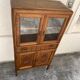 Old small glass display cabinet from the early 20th century.