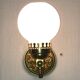 Brass and opal glass wall lights