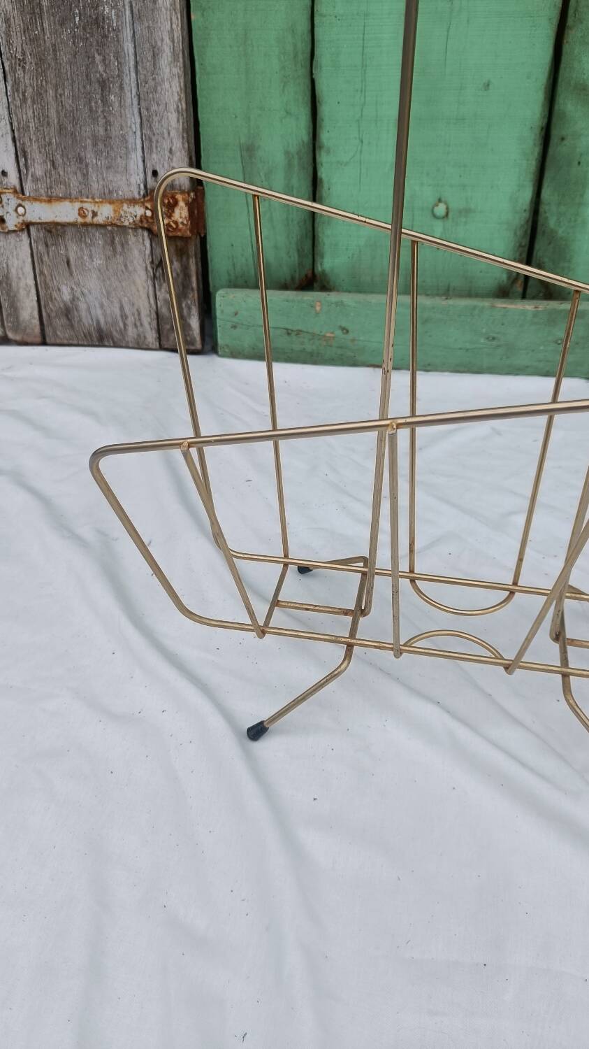 Vintage magazine rack in golden brass