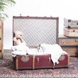 Old trunk travel suitcase burgundy color