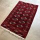 Bukhara rug with 12 panels in wool and burgundy silk, 88 x 54 cm.