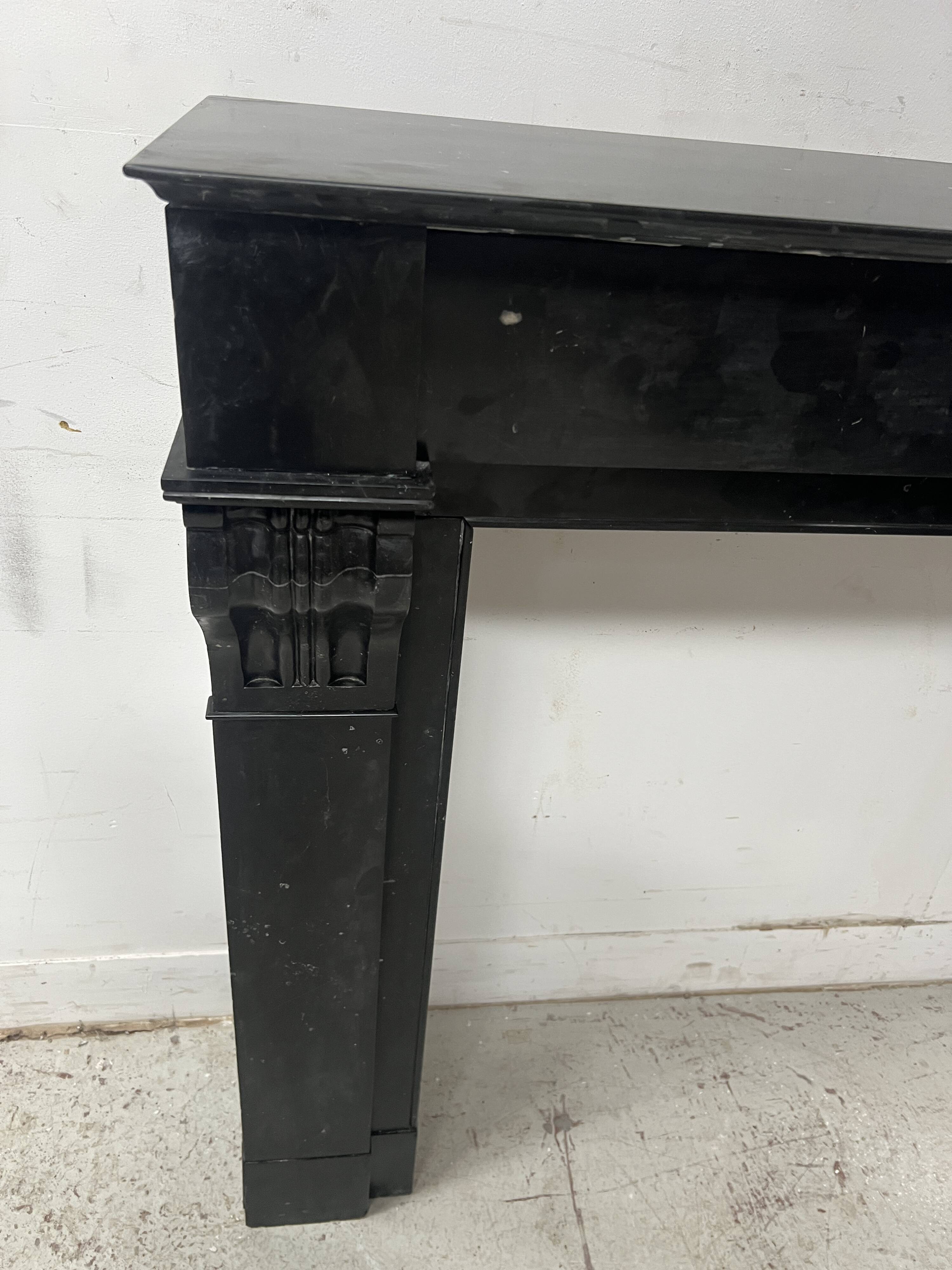 Napoleon III period fireplace with a black marble corbel. 19th century.