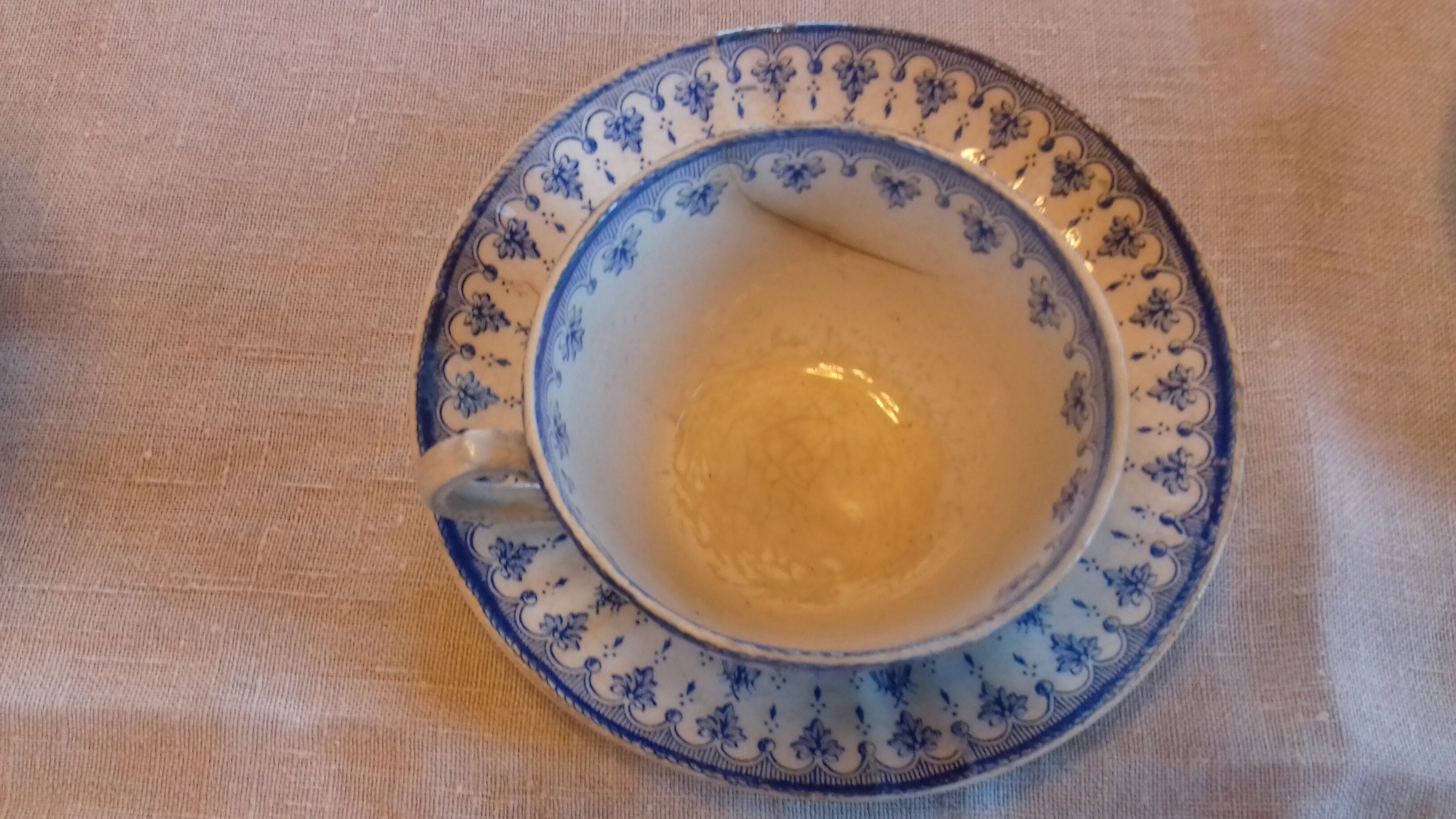 2 old coffee cups with their saucer, with blue bee patterns