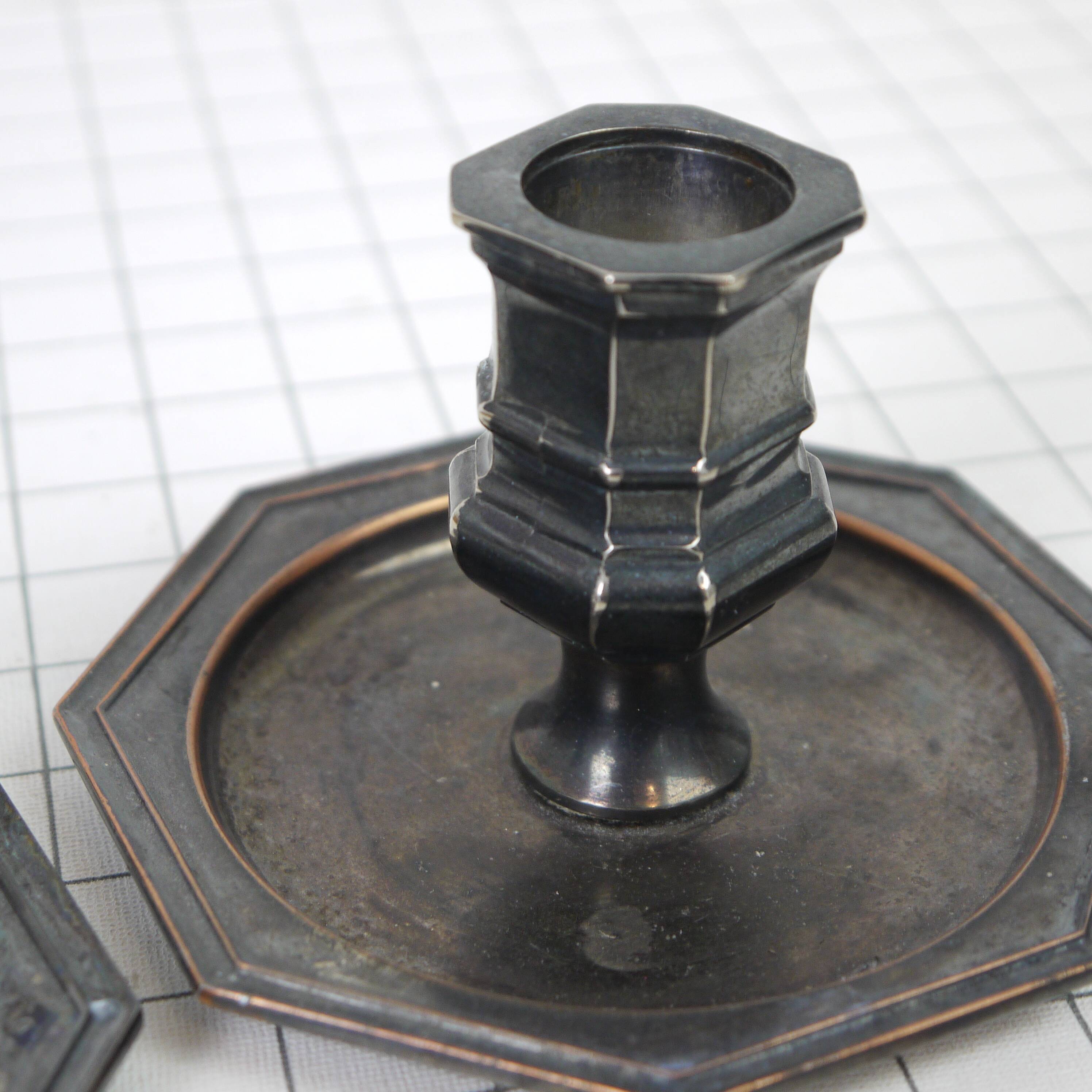 Pair of metal candlesticks