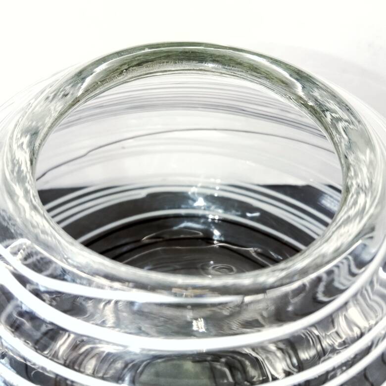 Textured oval blown glass vase with black and white glass spaghetti.