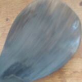 Rice spoon covered with serving in Asian handicraft horn