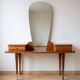 Vintage 1950s wooden vanity with mirror.