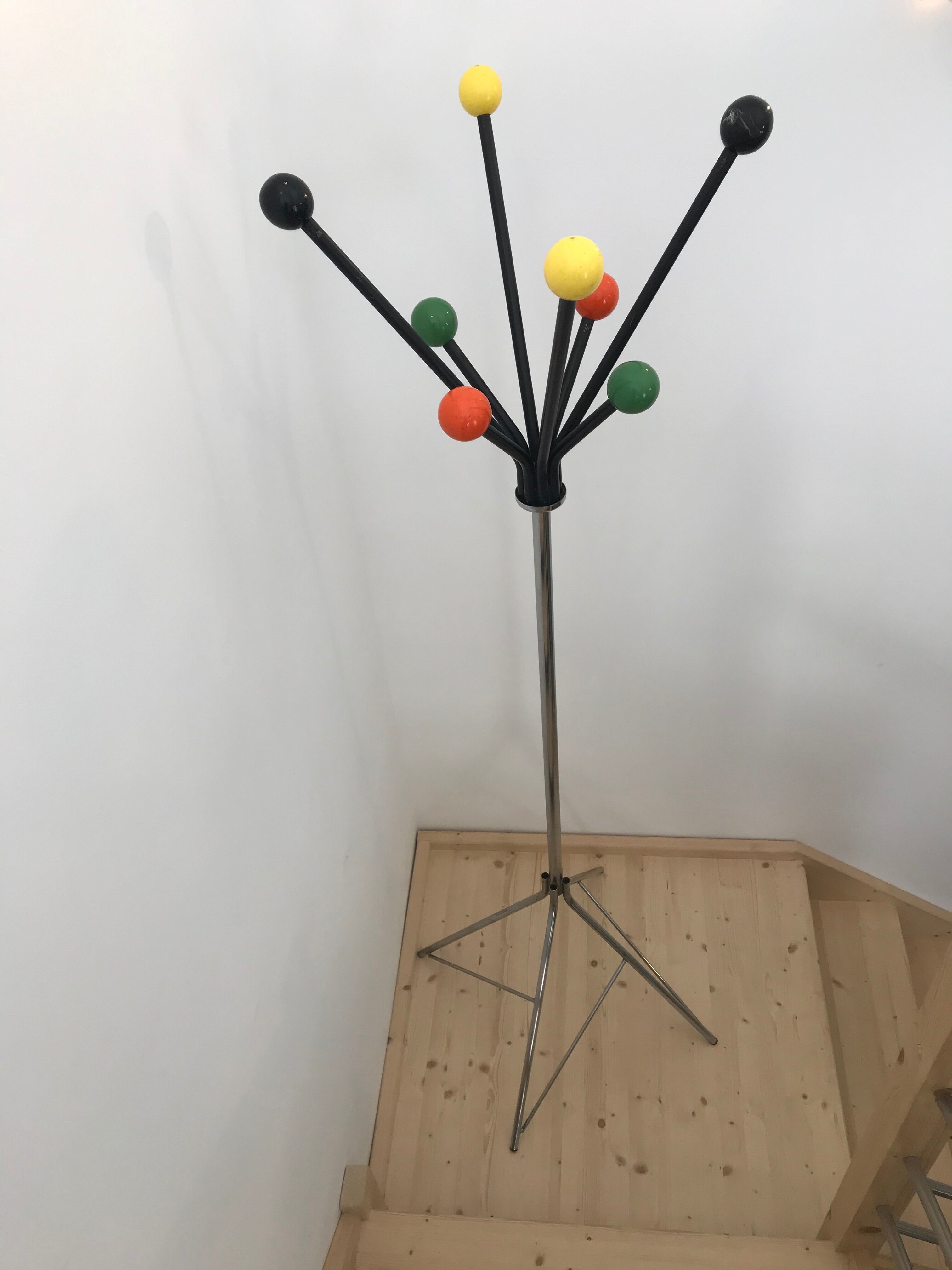 Wearing chrome parrot coat, black and multicolored balls