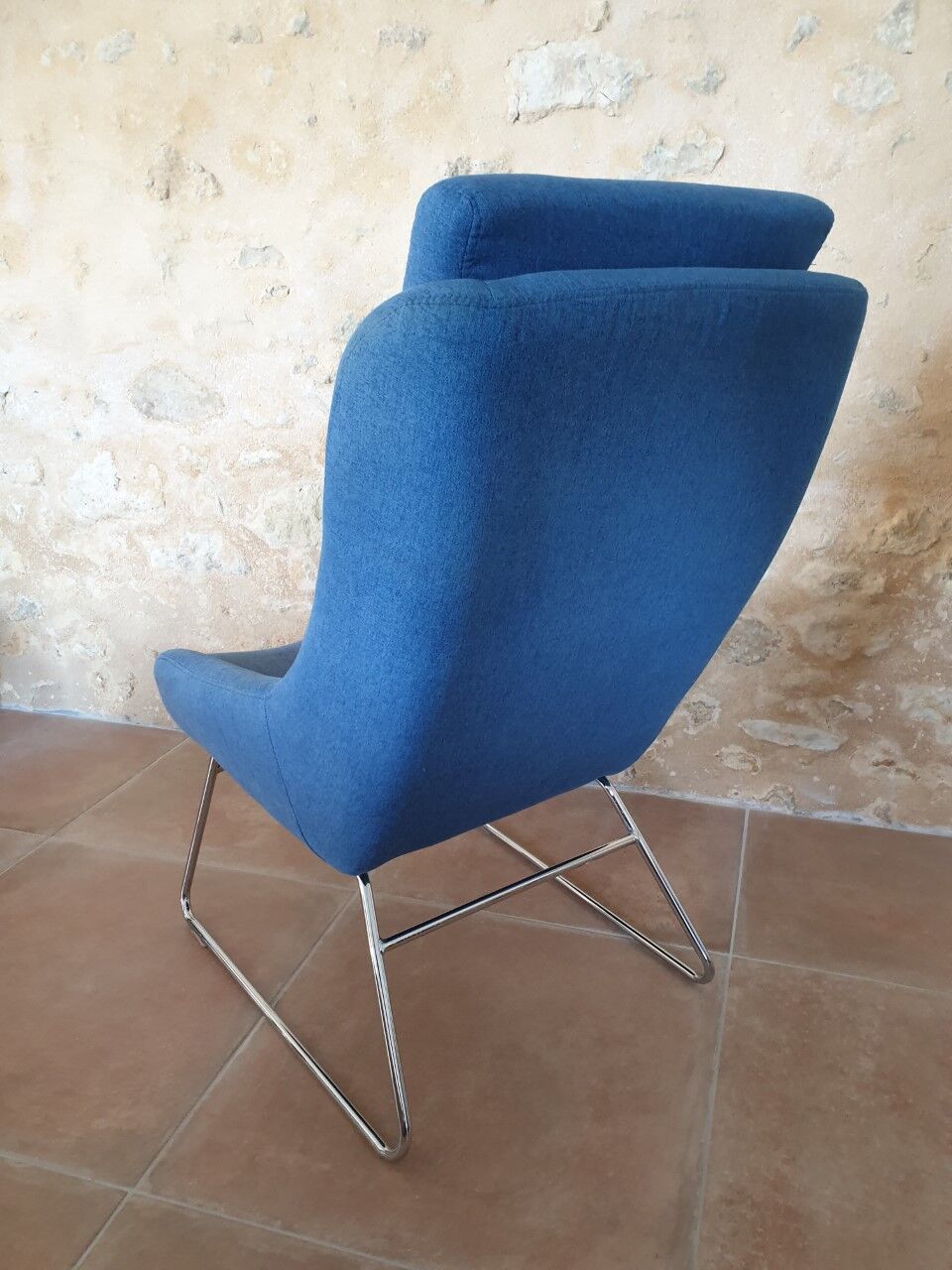 Armchair and its footrest