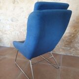 Armchair and its footrest