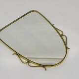 Elegant wall mirror in brass and black from the mid-century, Italy, 1950s.