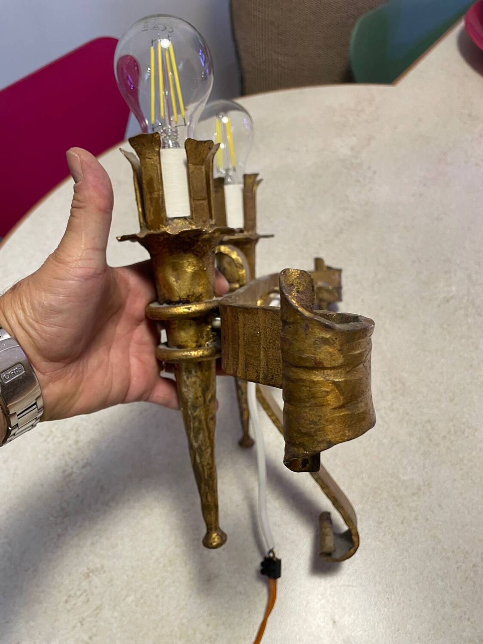 Spanish brutalist wall light in gilded wrought iron.