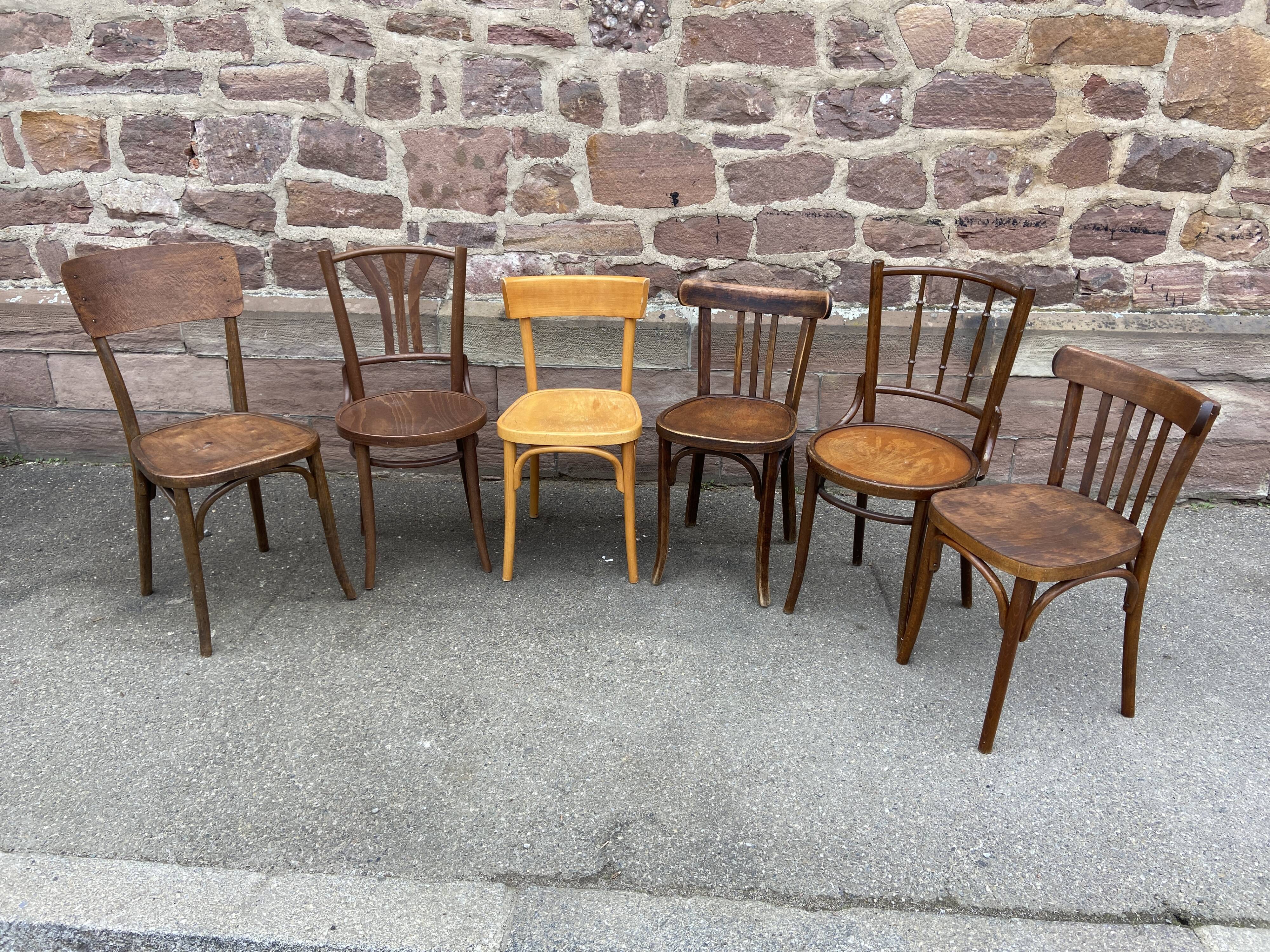 Lot 6 mismatched wooden bistro chairs