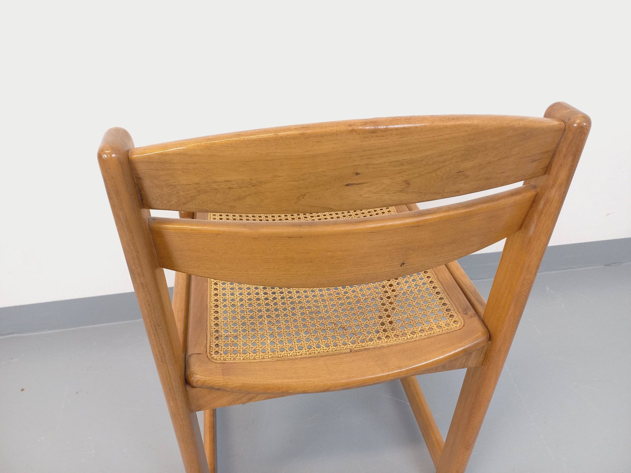 Vintage sleigh chair in beech wood and cane from the 70s and 80s