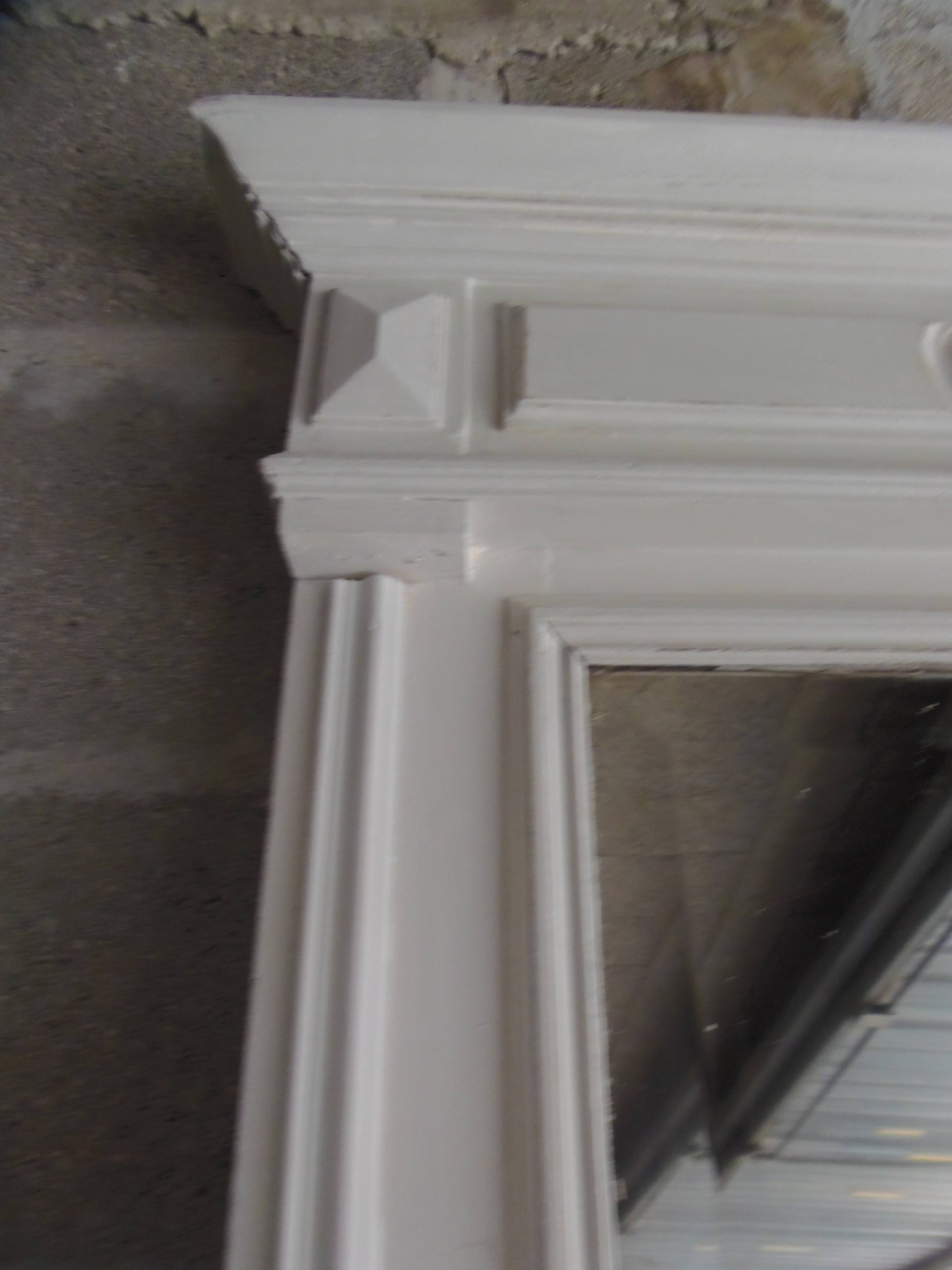 Antique bevelled mirror, frame in pearl grey patinated wood.