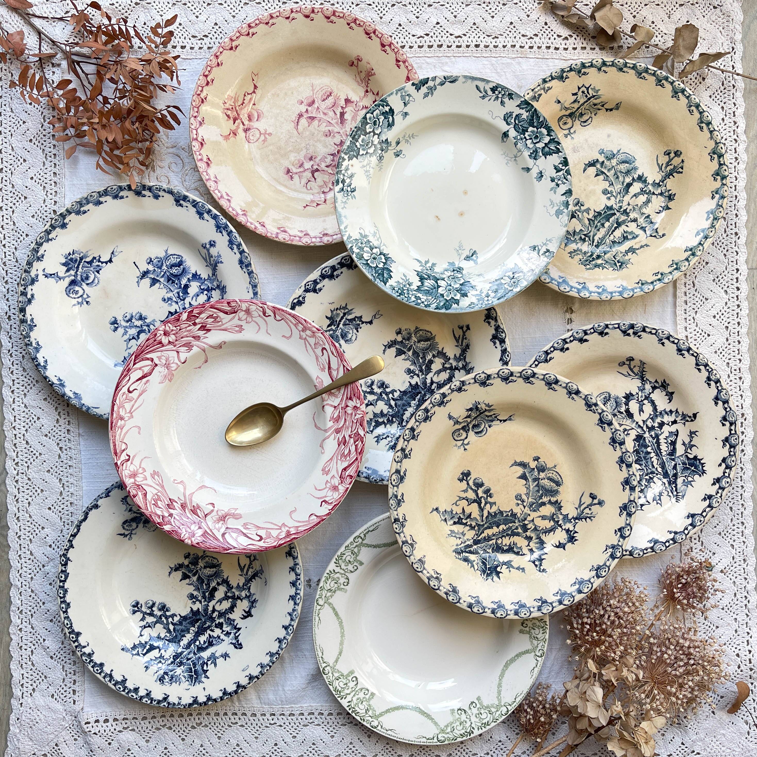 10 mismatched vintage soup plates in blue, green, and red ironstone