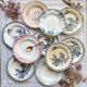 10 mismatched vintage soup plates in blue, green, and red ironstone