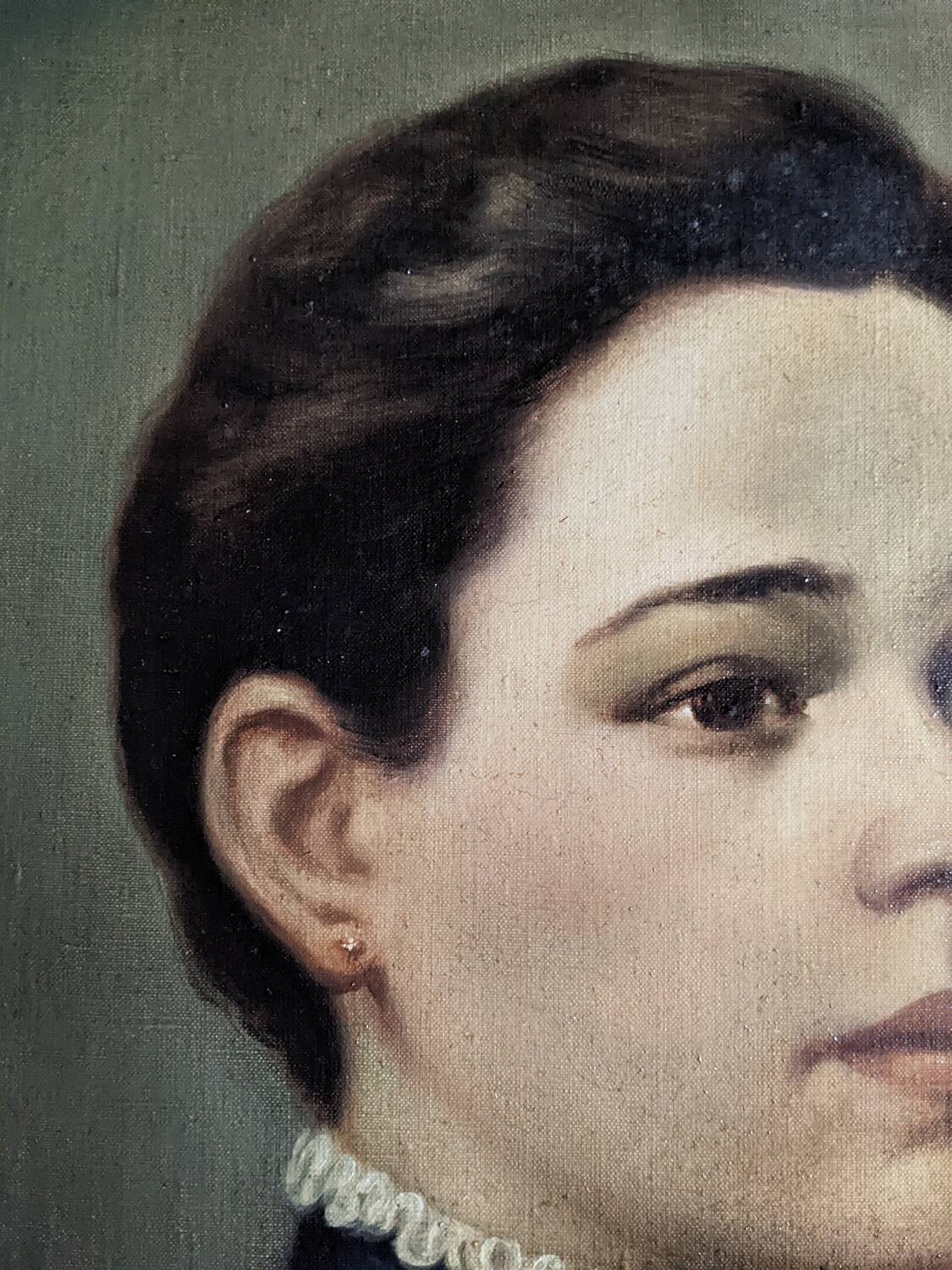 Oil on canvas portrait in an antique gilded wooden frame.