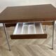 Vintage extendable kitchen table with wood effect Formica and chrome legs.