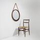 Round wall mirror with leather strap, 1960s