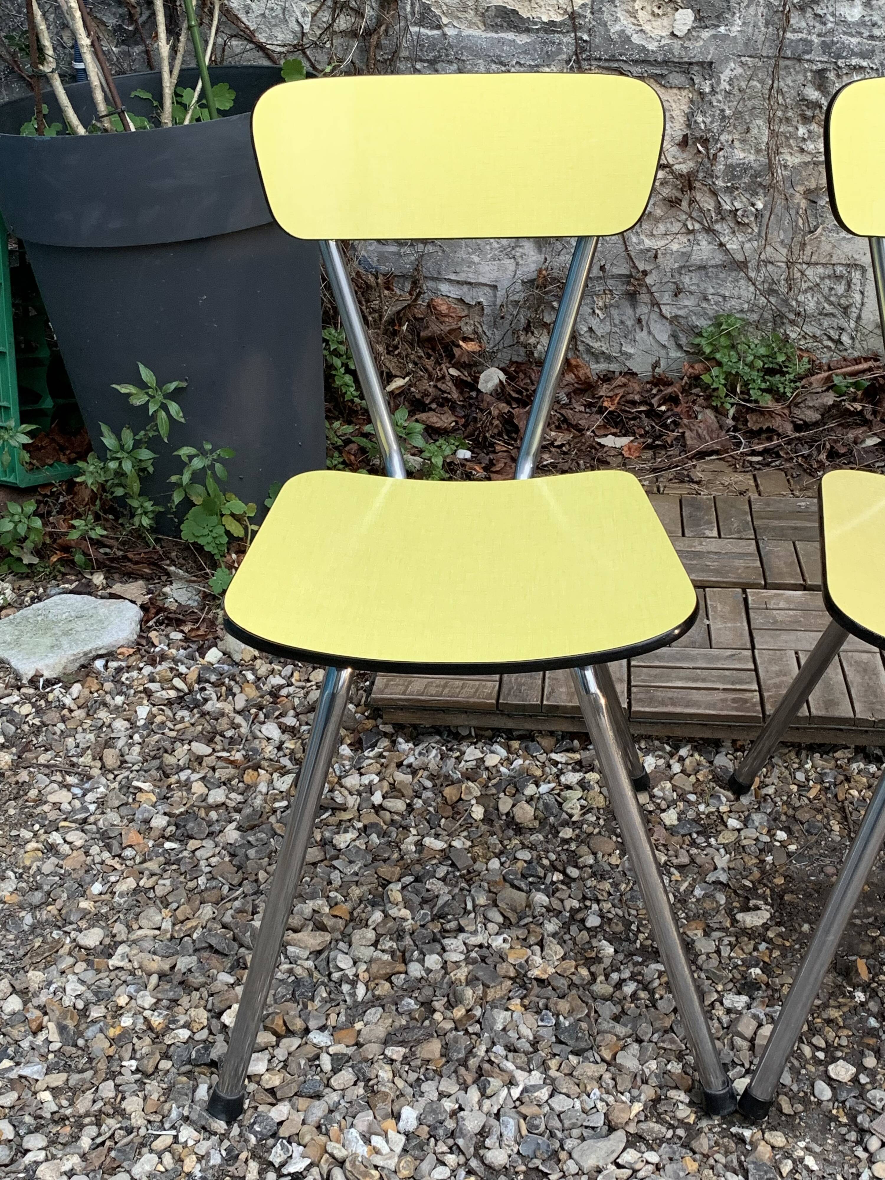 Yellow Formica chairs with compass legs, 1950s