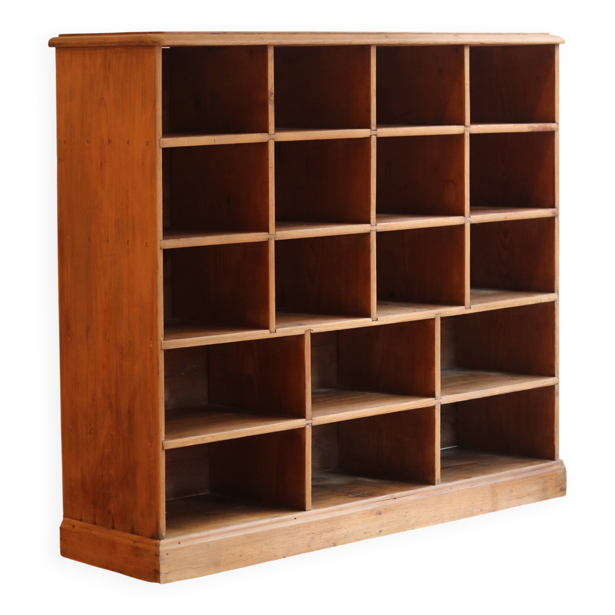 Large storage unit with compartments in waxed pine, early 20th century.