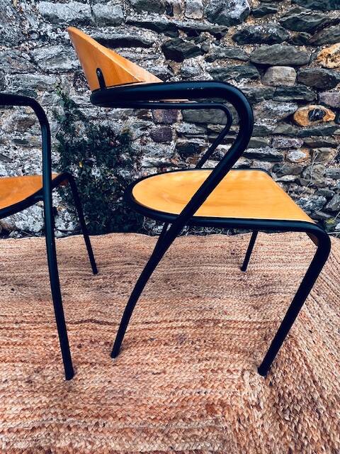 Pair of wooden and black metal chairs