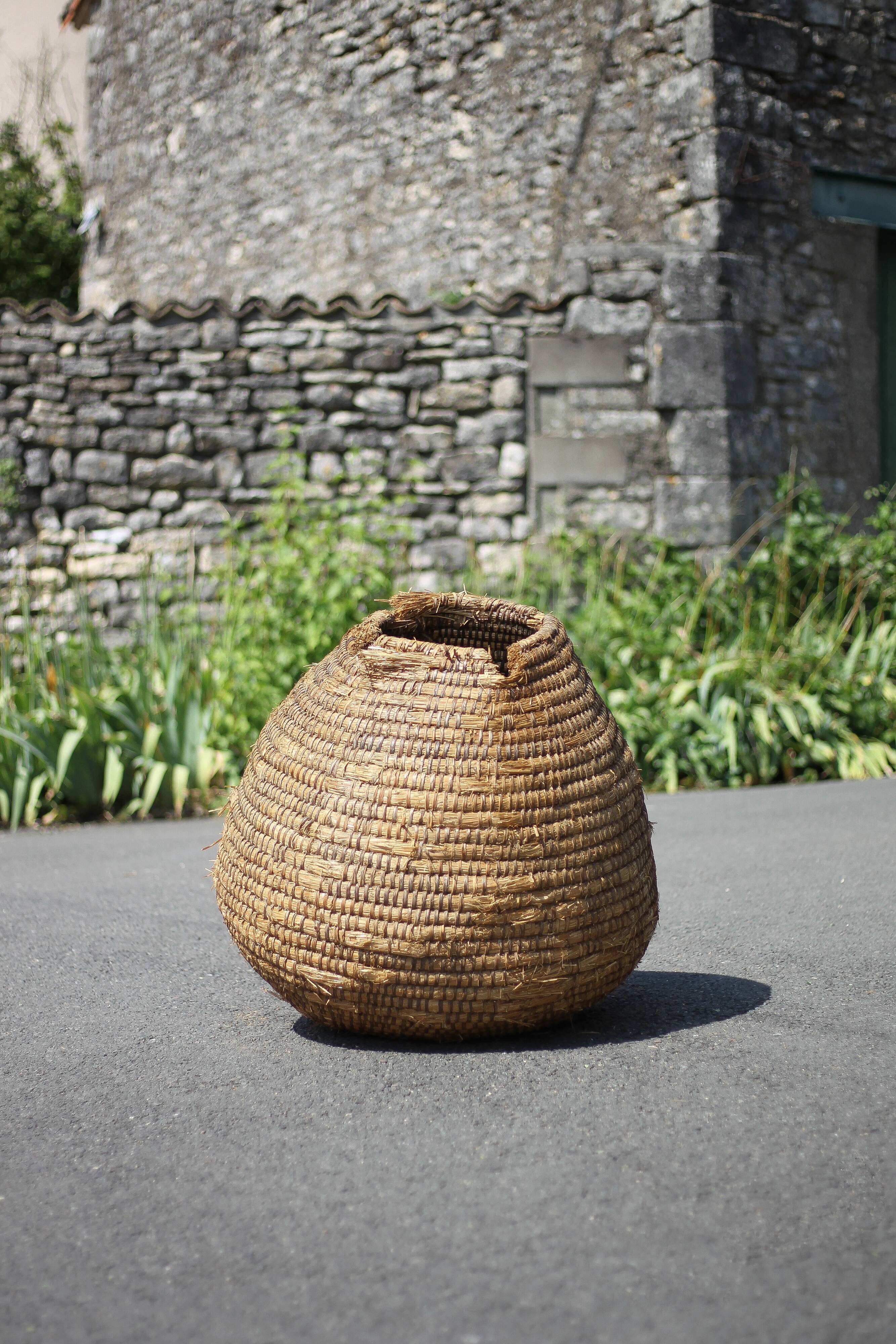Old basket, burgundy straw and bramble, woven basket, interior decoration