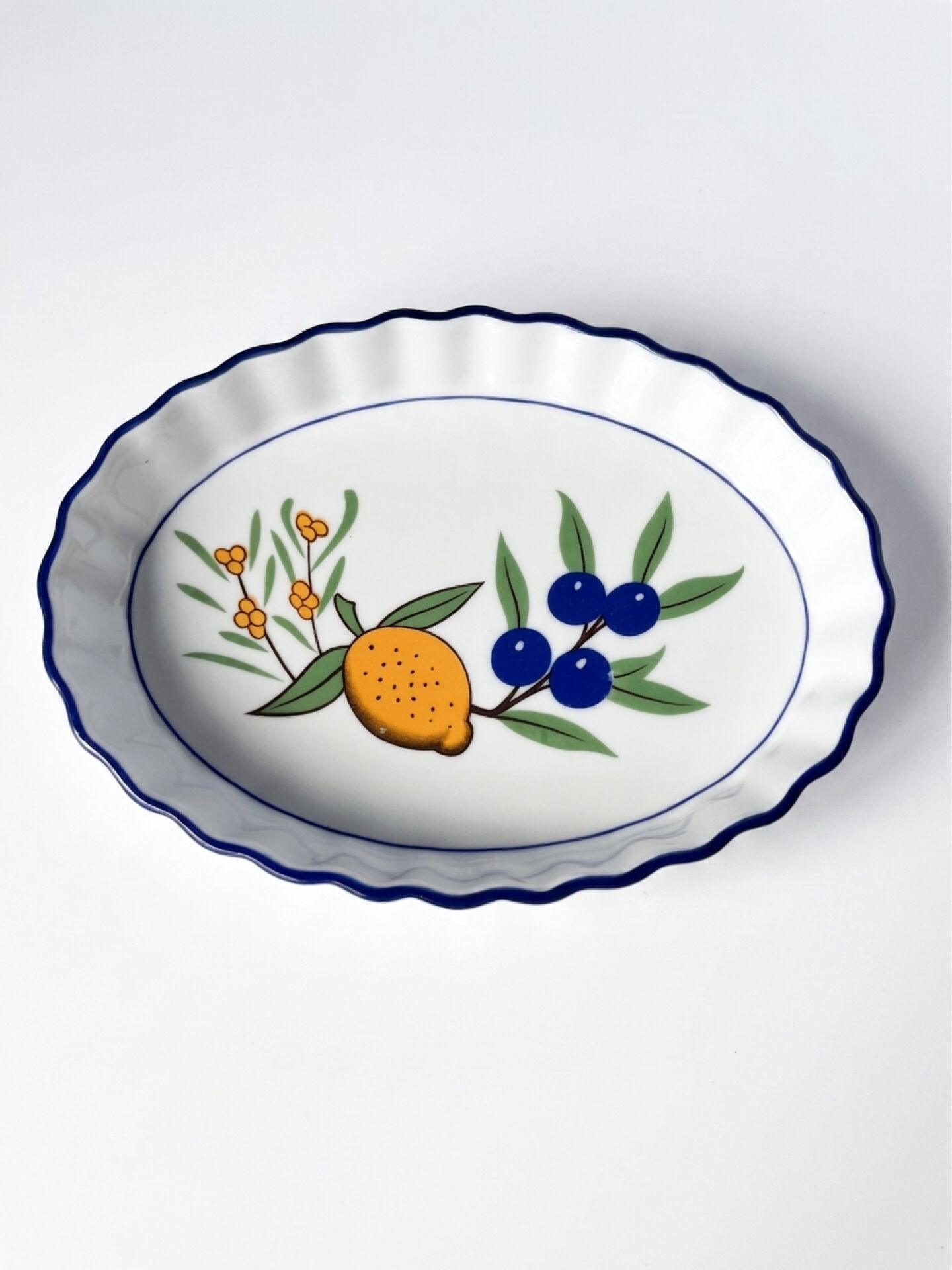 Set of 3 vintage ceramic dishes with wicker baskets.