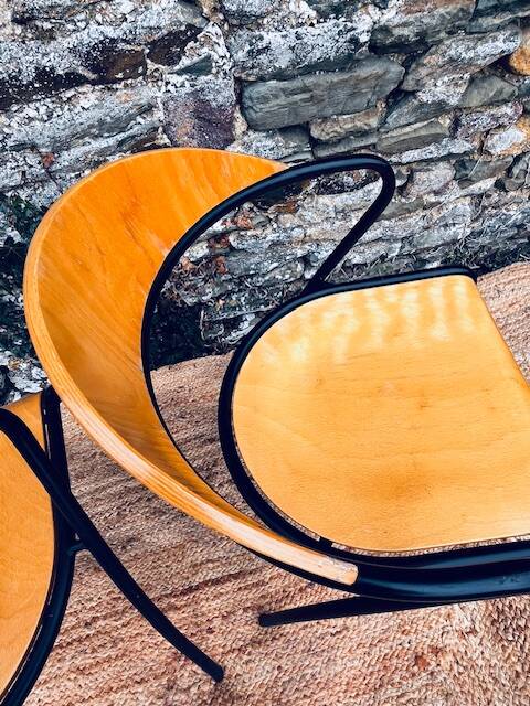 Pair of wooden and black metal chairs