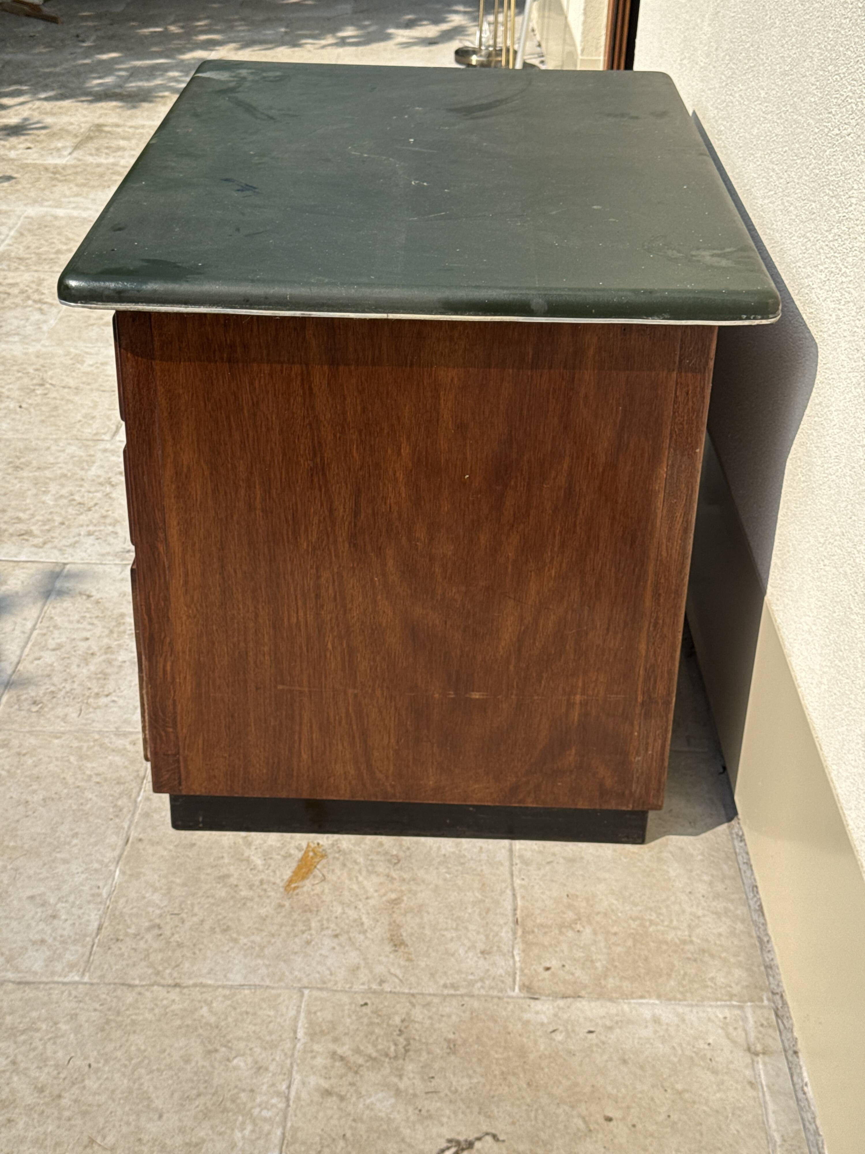 Modernist desk in wood and green moleskin upholstery