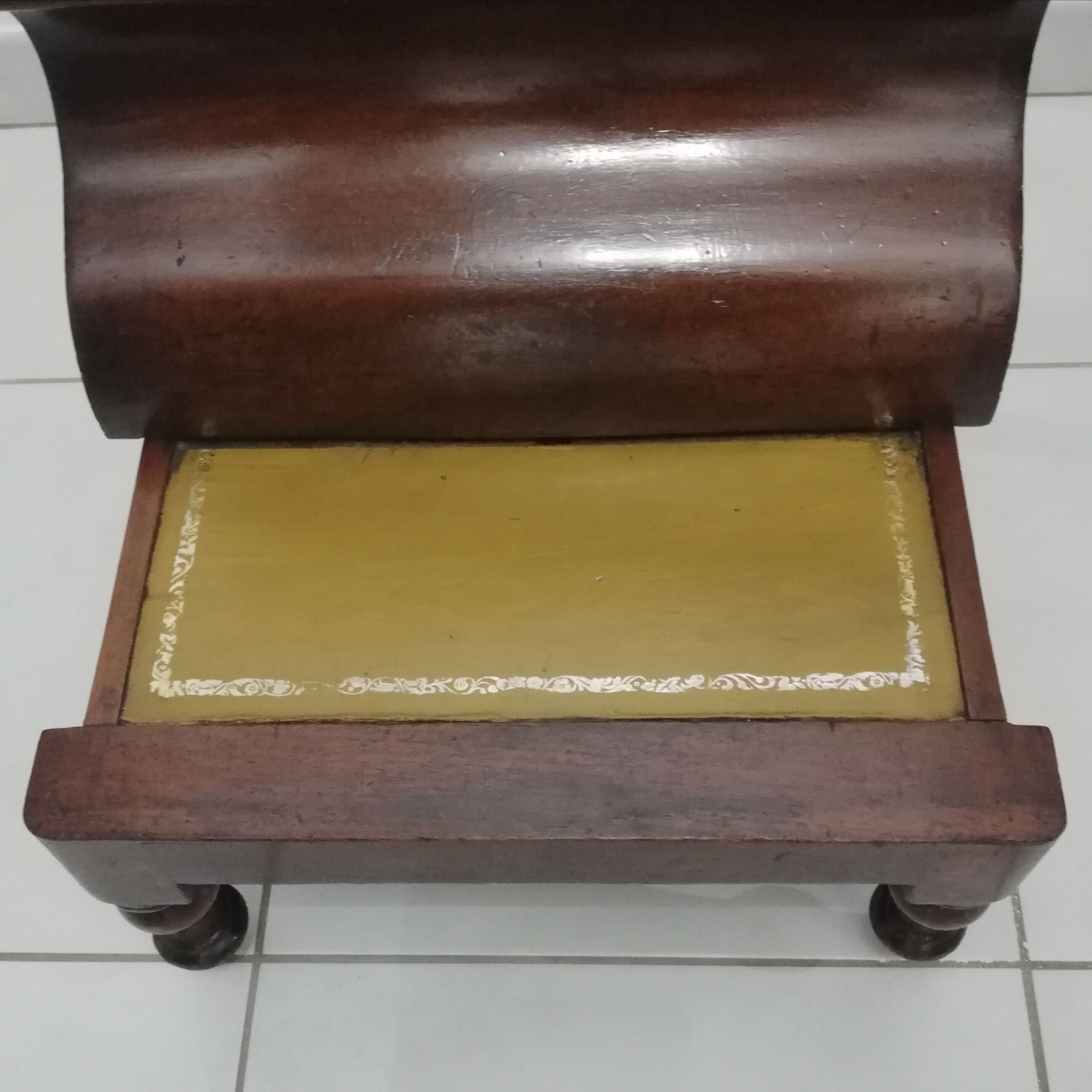 Old stepladder or English mahogany library foot walk