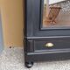 Bookcase black patina shell pediment 2 drawer doors