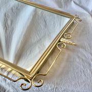Miroir mural Hollywood Regency en laiton doré - 70 x 46 cm