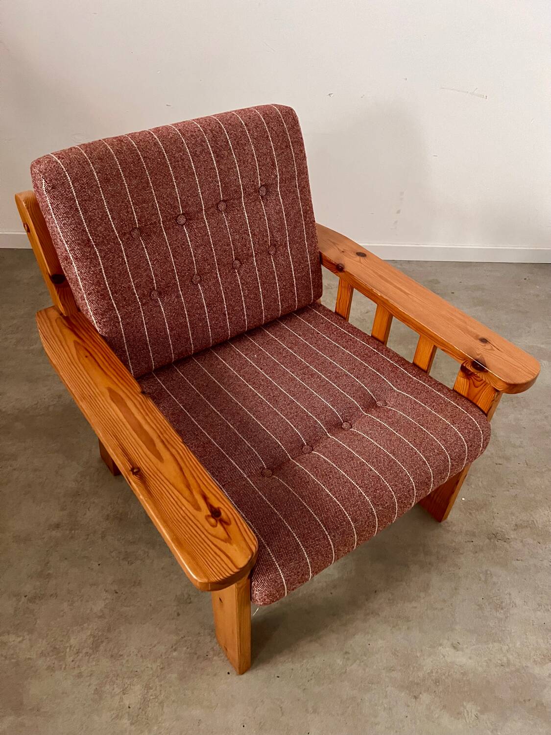 Old vintage Scandinavian design pine armchair from the 70s