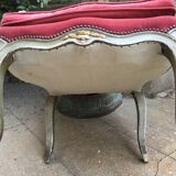 Louis XV style armchair in molded and carved wood with gray and gold patina