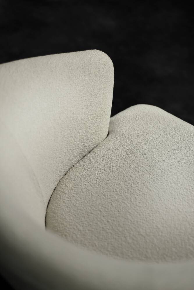 Low oak armchair with modern mid-century Scandinavian fabric and rounded backrest, 1960s.