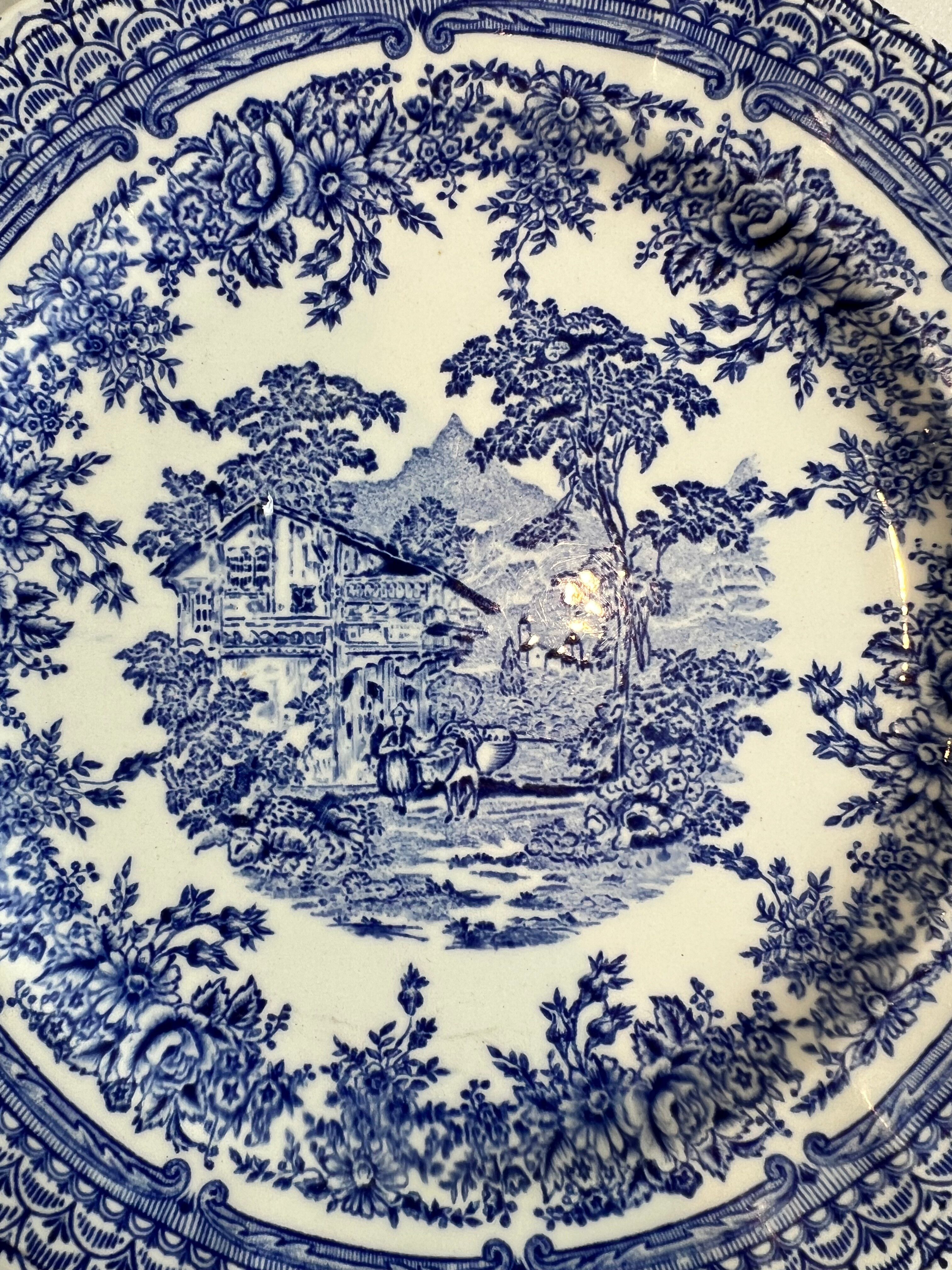 Set of four flat plates from English earthenware.