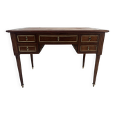 Louis XVI style desk in mahogany and mahogany veneer, 20th century.
