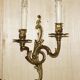 Pair of antique wall sconces from the 1920s in gilded bronze.