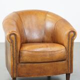 Fauteuil club en cuir de mouton patiné couleur cognac