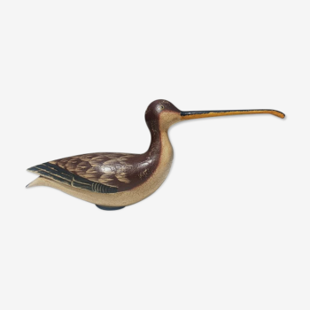 Carved painted wooden curlew