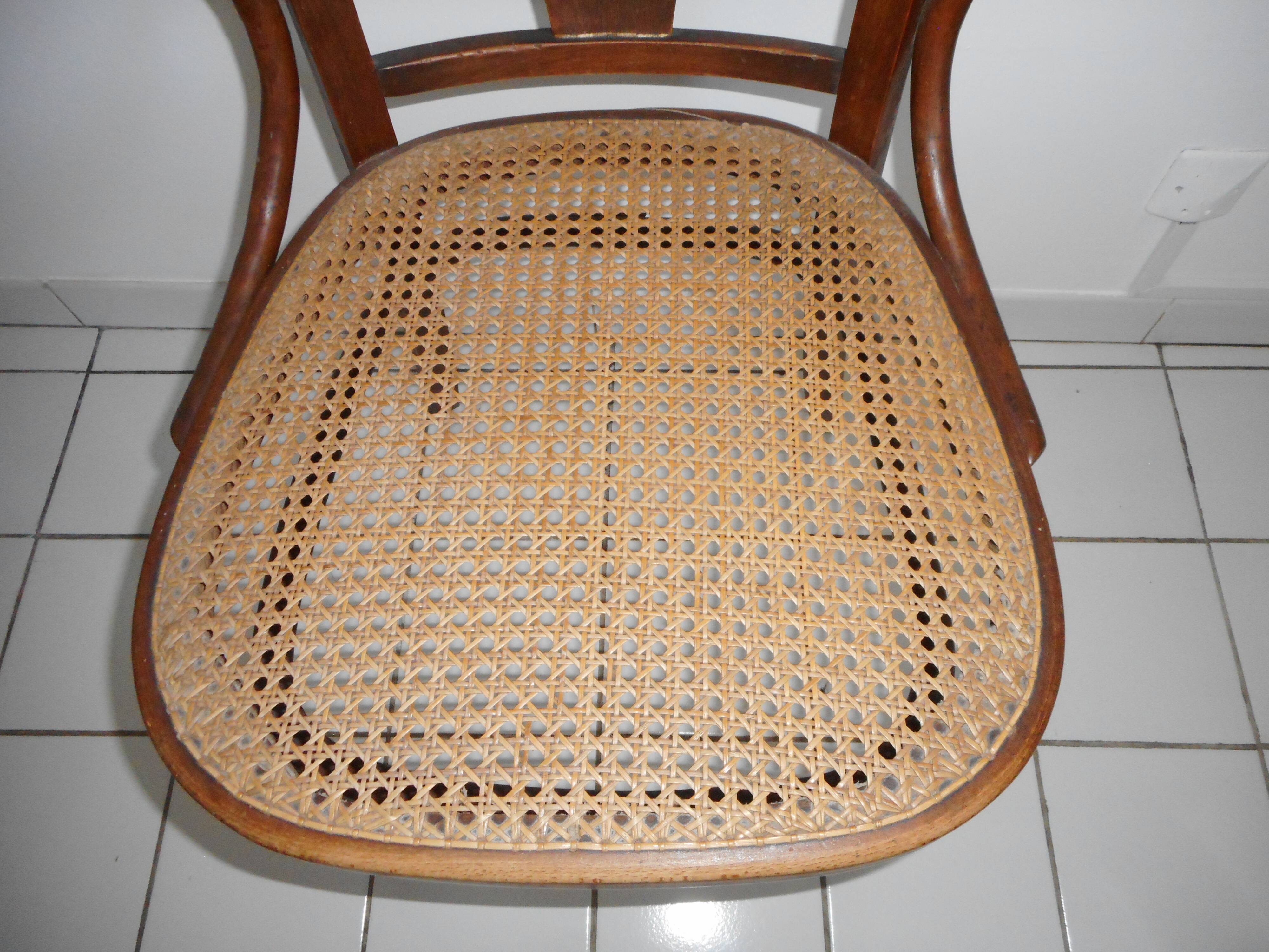 Wooden armchair with caned base