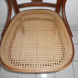 Wooden armchair with caned base