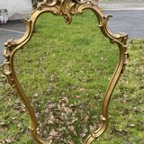 Louis XV Style wood and gilded stucco mirror with animated shape
