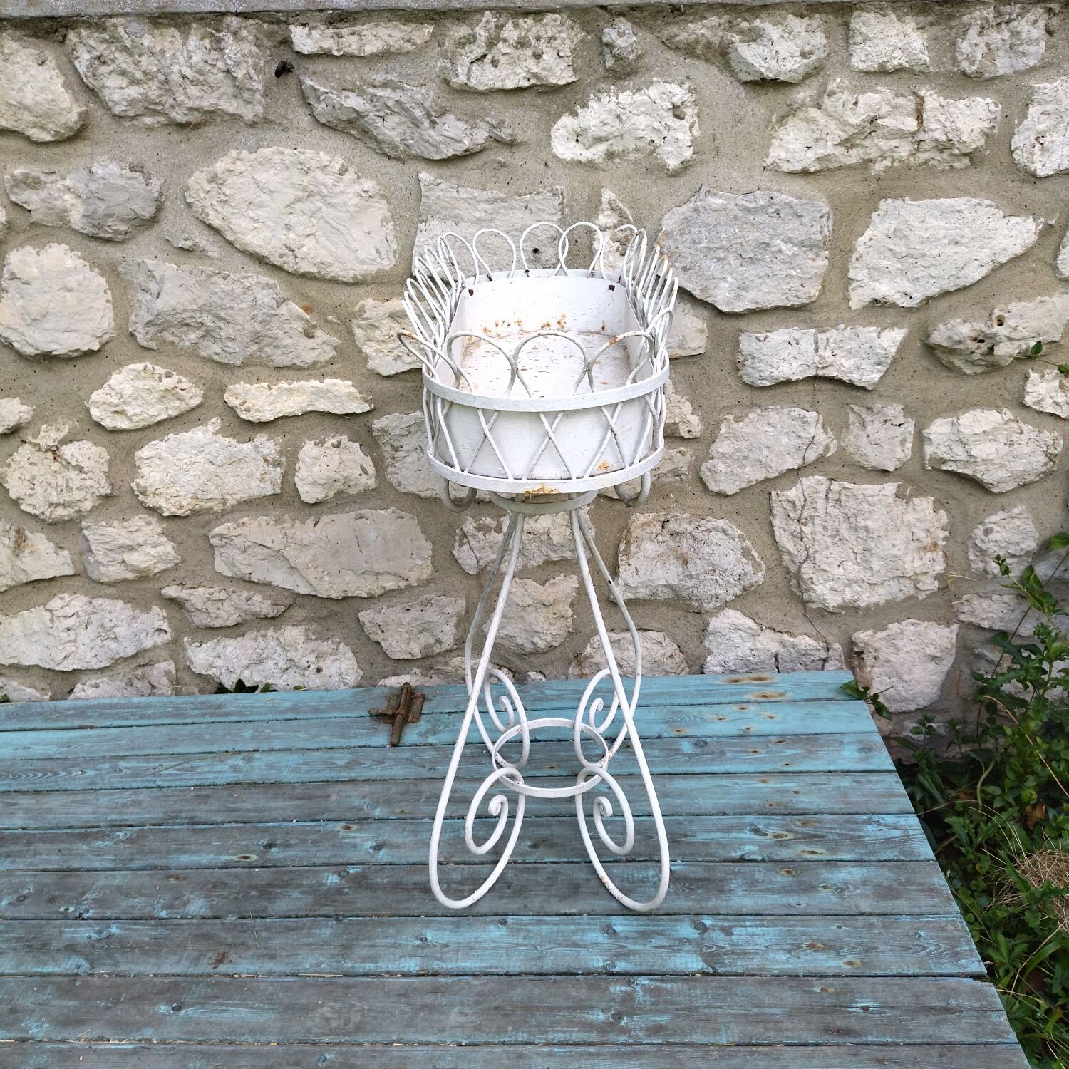 Wrought iron plant holder from the 1950s
