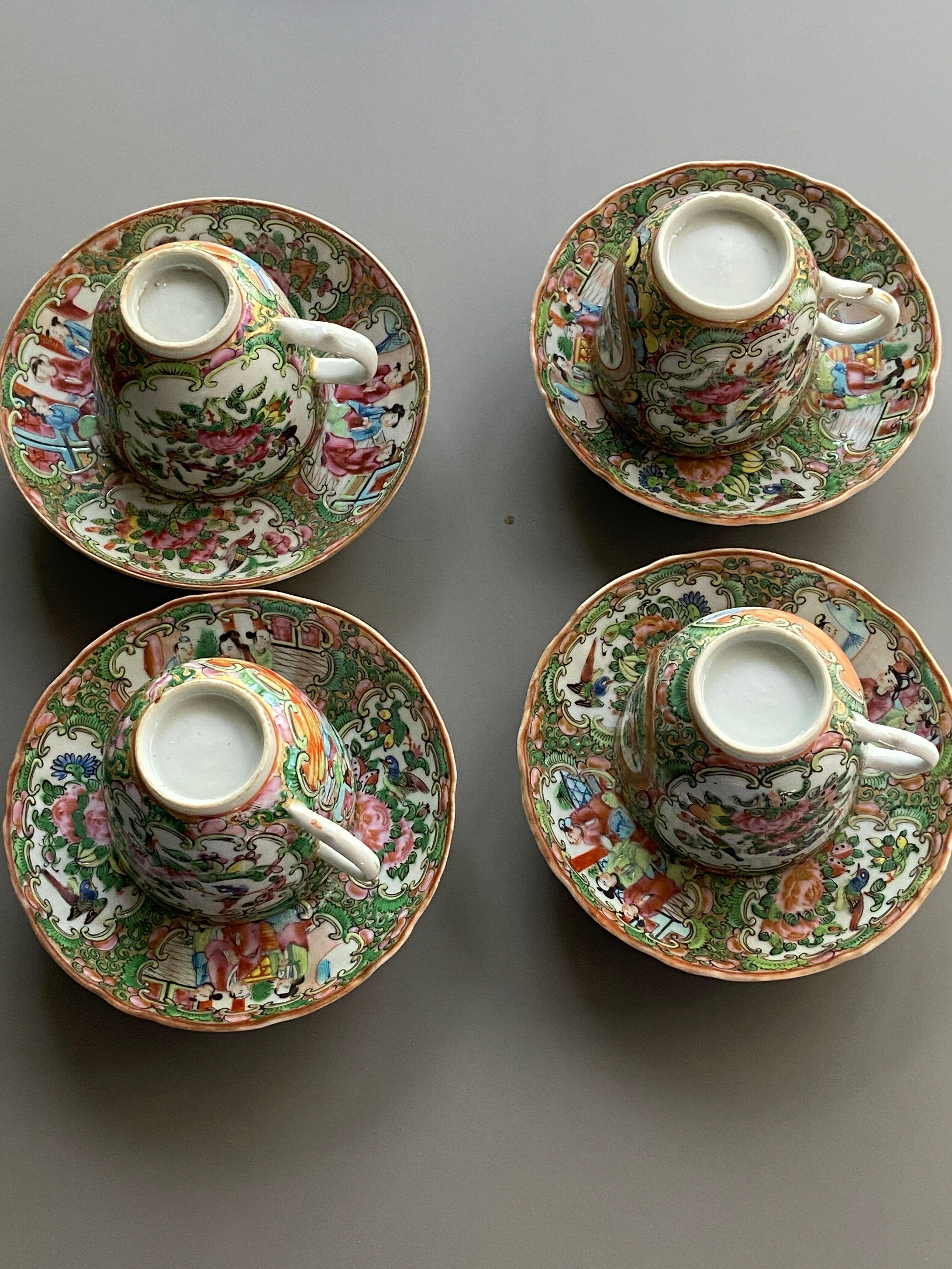 Four coffee cups and matching saucers in porcelain.